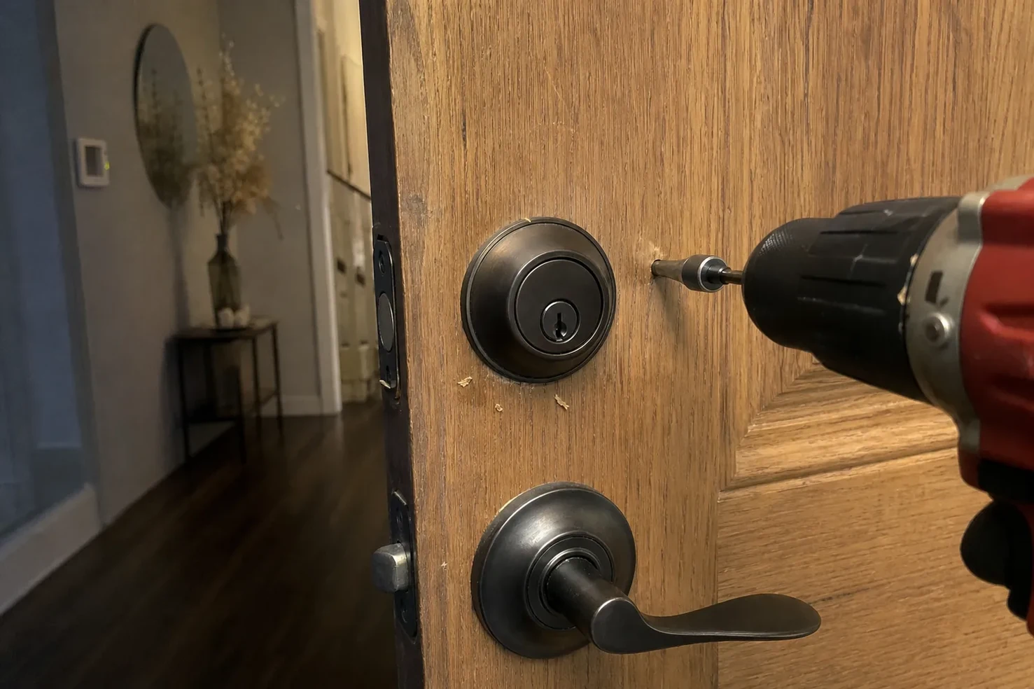 New deadbolt being installed in a front door